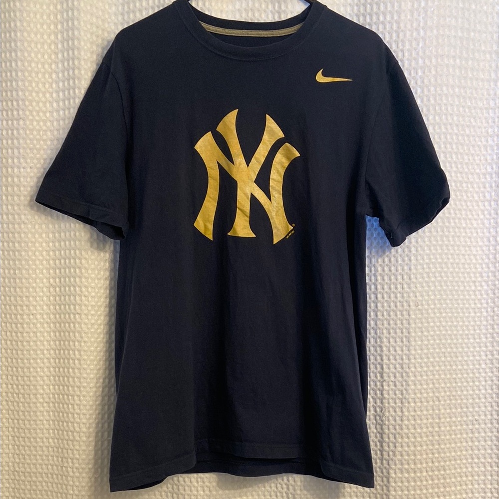 Nike Dark Blue Tee with Gold Emblem